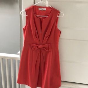 Trina Turk peach colored dress with bow detail